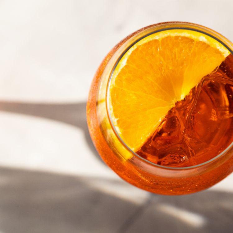 A top down view of a glass of JOY orange spritz.